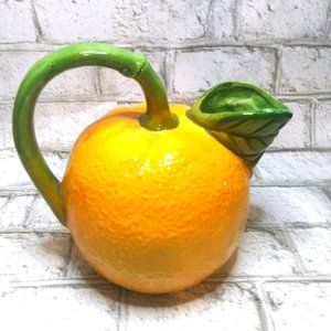 Orange juice pitcher green leaf handle